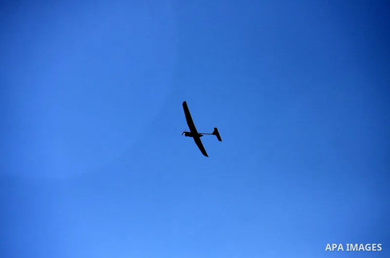 Israeli soldiers launch a drone near the West Bank village of Awarta on March 12, 2011 as troops were hunting a suspected Palestinian who killed five members of an Israeli family at a settlement, officials and media repo...