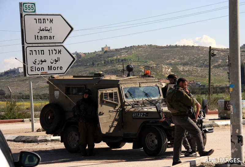 Israeli troops operate in the West Bank village of Awarta, after five people were killed in the nearby Jewish settlement of Itamar Saturday, March 12, 2011. A Palestinian infiltrated Itamar early Saturday and killed five...