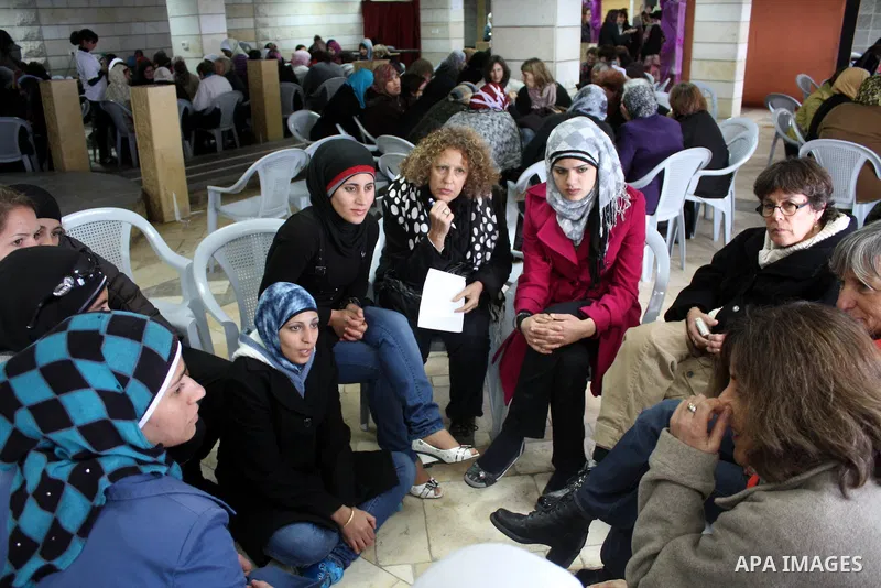 Palestinian and israeli women take part in a Palestinian_Jewish conference of the occasion of the 100th International Womens Day on March 12,2011 in Beit Omar village near the West Bank city of Hebron. Photo by Najeh Has...