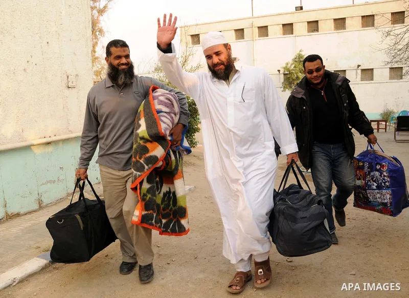 Egyptian Abbud and Tareq al-Zomor, members of Egypt's Islamic Jihad, are seen after being released form the Tura jail, in Hilwan on the outskirts of Cairo, on March 12, 2011, after Egypt's new military rulers ordered the...