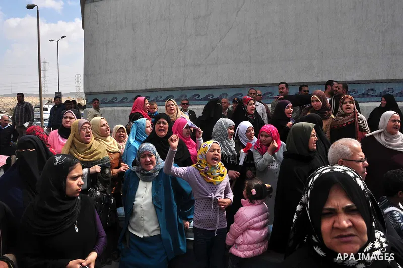Egyptian wait for the release of Abbud al-Zomor and his cousin Tareq, members of Egypt's Islamic Jihad, from Tura jail, in Hilwan on the outskirts of Cairo, on March 12, 2011, after Egypt's new military rulers ordered th...