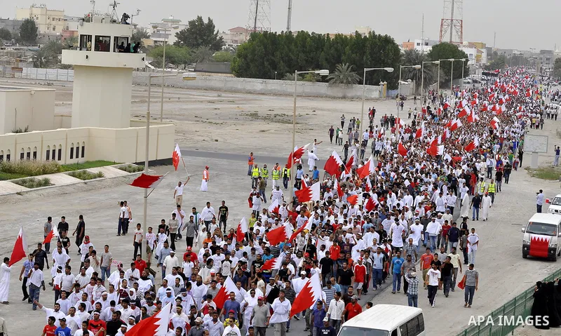 Tens of thousands of Bahraini anti-government protesters converged from two directions Saturday, March 12, 2011, to demonstrate outside the walls of King Hamad bin Isa Al Khalifa's Safriya palace in Sadad, Bahrain, south...