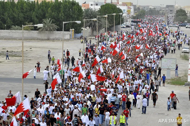 Tens of thousands of Bahraini anti-government protesters converged from two directions Saturday, March 12, 2011, to demonstrate outside the walls of King Hamad bin Isa Al Khalifa's Safriya palace in Sadad, Bahrain, south...