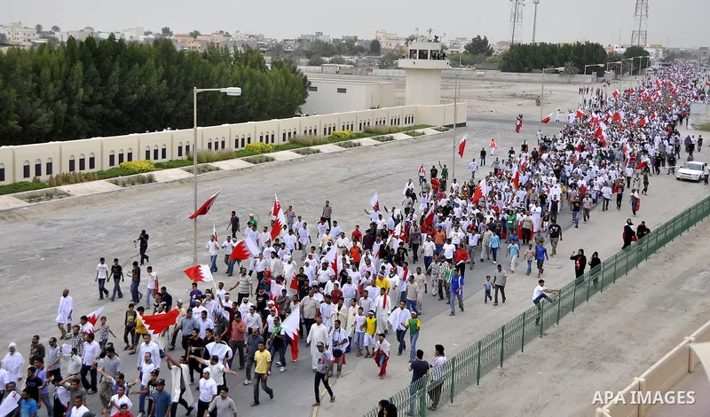 Tens of thousands of Bahraini anti-government protesters converged from two directions Saturday, March 12, 2011, to demonstrate outside the walls of King Hamad bin Isa Al Khalifa's Safriya palace in Sadad, Bahrain, south...