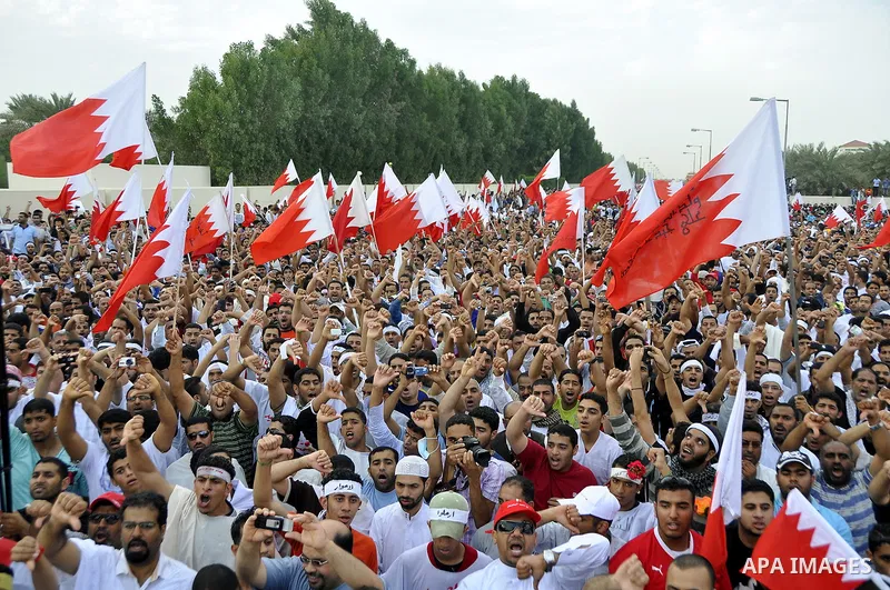 Tens of thousands of Bahraini anti-government protesters converged from two directions Saturday, March 12, 2011, to demonstrate outside the walls of King Hamad bin Isa Al Khalifa's Safriya palace in Sadad, Bahrain, south...