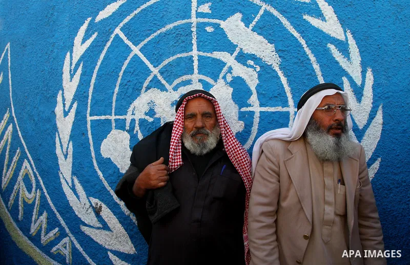 Palestinian lost their homes during the Israeli war in 2008-2009 attend a gathering calling for ending the siege in front of the United Nations Relief and Works Agency (UNRWA) headquarters in Gaza City March 13,2011. Pho...