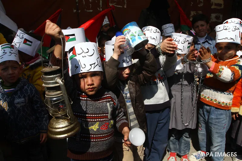 Palestinian students attend a gathering calling for ending the siege in front of the United Nations Relief and Works Agency (UNRWA) headquarters in Gaza City on March 13,2011. Photo by Ashraf Amra