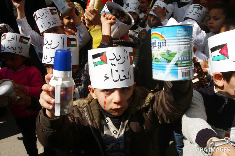 Palestinian students attend a gathering calling for ending the siege in front of the United Nations Relief and Works Agency (UNRWA) headquarters in Gaza City on March 13,2011. Photo by Ashraf Amra