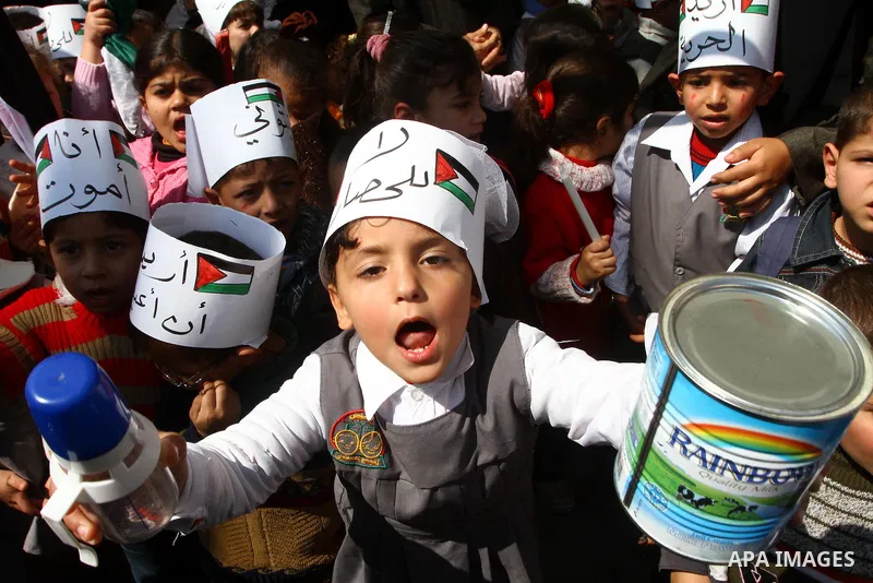 Palestinian students attend a gathering calling for ending the siege in front of the United Nations Relief and Works Agency (UNRWA) headquarters in Gaza City on March 13,2011. Photo by Ashraf Amra