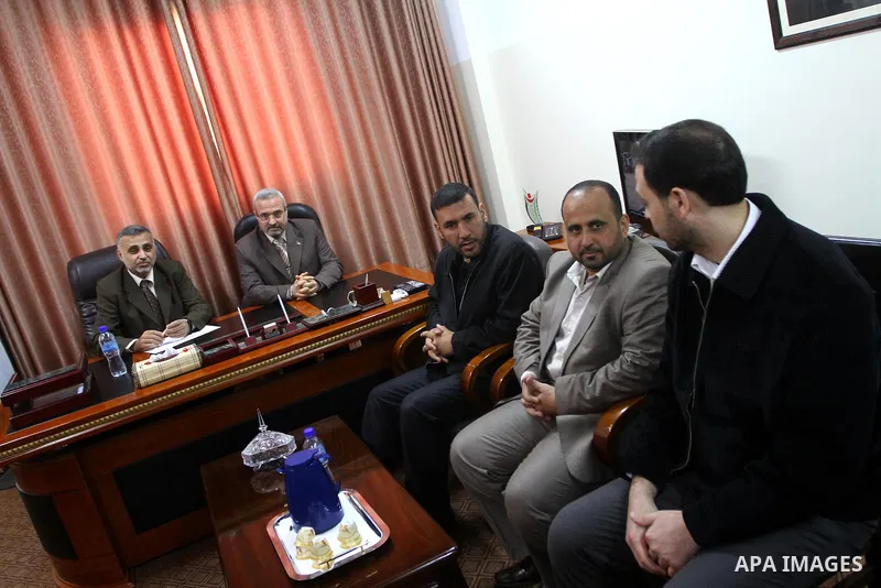 Palestinian minister, Mohammed Asqoul receives the General Secretariat of the Council of Ministers from the minister, Mohammed Awad in Gaza City on March 13,2011. Photo by Ashraf Amra