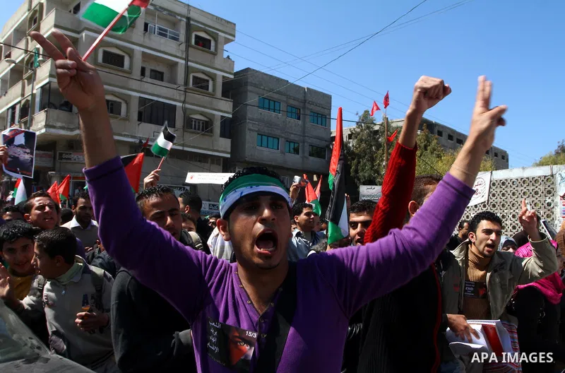 Palestinians participate in a march calling for a reconciliation between the rival Palestinian leading factions Hamas in Gaza and Fatah in the West Bank, in Gaza City, Monday, March 14, 2011. Photo by Ashraf Amra