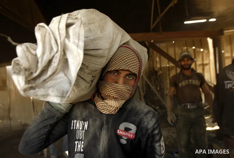 Palestinian men smuggle cement into the Gaza Strip through a tunnel under the Egypt-Gaza border in Rafah on March 14, 2011. Israel's blockade of the Gaza Strip was imposed after the militant Hamas group violently seized...
