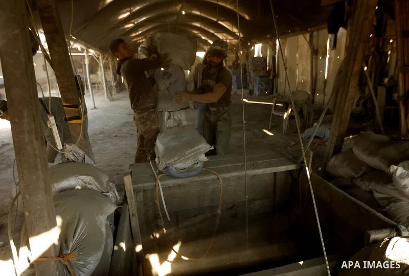 Palestinian men smuggle cement into the Gaza Strip through a tunnel under the Egypt-Gaza border in Rafah on March 14, 2011. Israel's blockade of the Gaza Strip was imposed after the militant Hamas group violently seized...