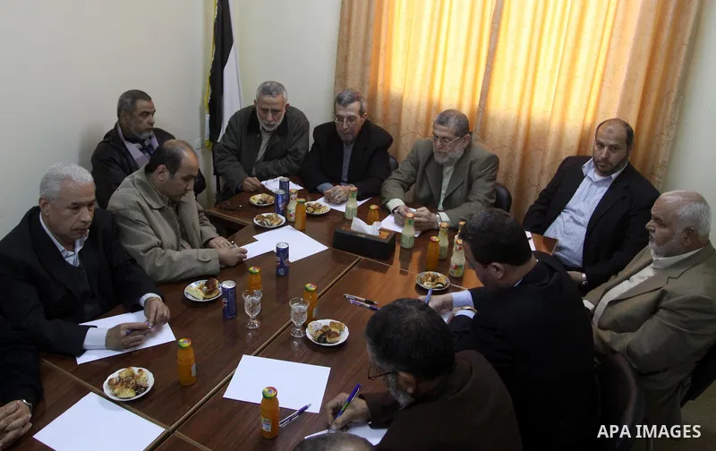 Palestinian factions leaders attend a meeting to discuss the protests calling for a reconciliation between the rival Palestinian leading factions Hamas in Gaza and Fatah in the West Bank, in Gaza City, Monday, March 14,...