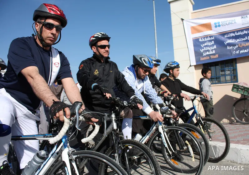 Palestinians compete during cycling race in the West Bank city of Hebron on March 14,2011.This event is the first of it kind on the local level and it was organized by the Palestinian Ministery of youth and sport as a pr...