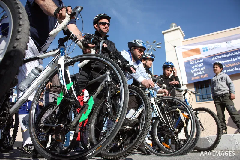 Palestinians compete during cycling race in the West Bank city of Hebron on March 14,2011.This event is the first of it kind on the local level and it was organized by the Palestinian Ministery of youth and sport as a pr...