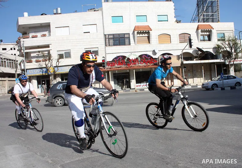 Palestinians compete during cycling race in the West Bank city of Hebron on March 14,2011.This event is the first of it kind on the local level and it was organized by the Palestinian Ministery of youth and sport as a pr...