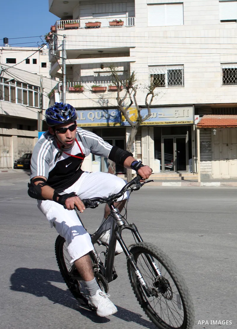 Palestinians compete during cycling race in the West Bank city of Hebron on March 14,2011.This event is the first of it kind on the local level and it was organized by the Palestinian Ministery of youth and sport as a pr...