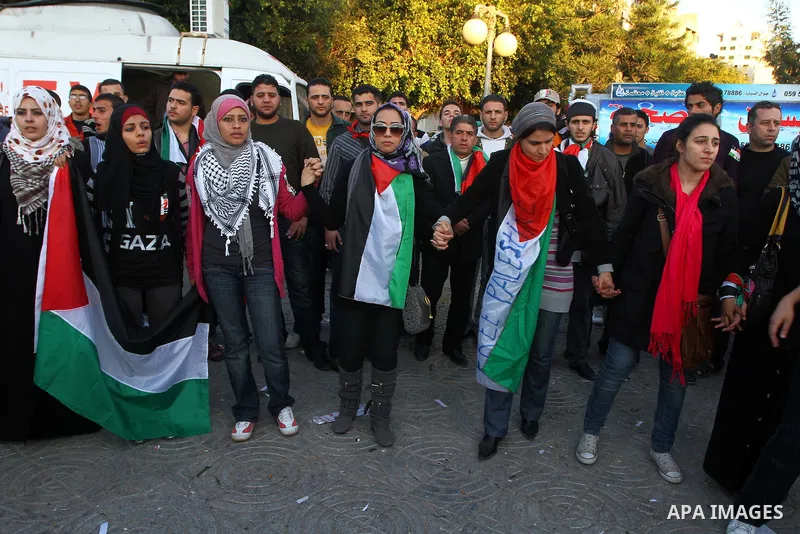 Palestinians participate in a march calling for a reconciliation between the rival Palestinian leading factions Hamas in Gaza and Fatah in the West Bank, in Gaza City, Monday, March 14, 2011. Photo by Ashraf Amra