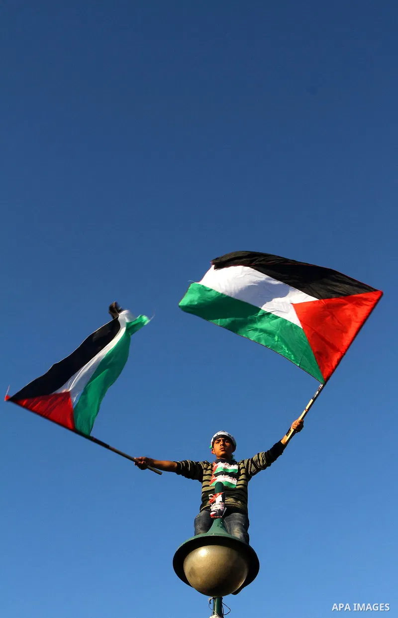 Palestinians participate in a march calling for a reconciliation between the rival Palestinian leading factions Hamas in Gaza and Fatah in the West Bank, in Gaza City, Monday, March 14, 2011. Photo by Ashraf Amra