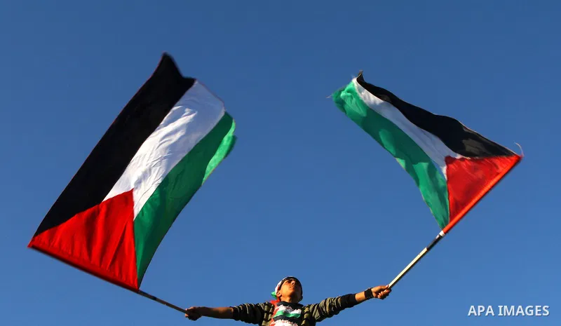 Palestinians participate in a march calling for a reconciliation between the rival Palestinian leading factions Hamas in Gaza and Fatah in the West Bank, in Gaza City, Monday, March 14, 2011. Photo by Ashraf Amra