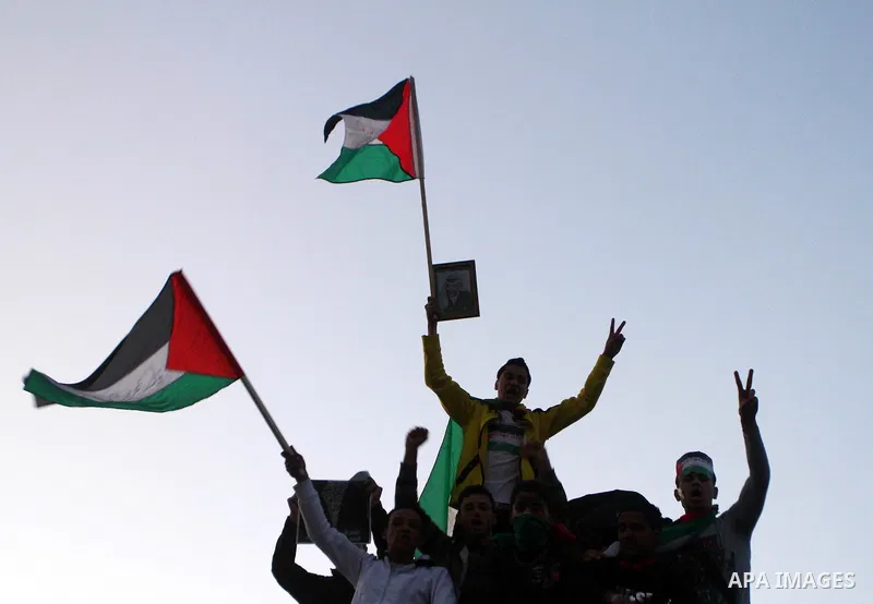 Palestinians participate in a march calling for a reconciliation between the rival Palestinian leading factions Hamas in Gaza and Fatah in the West Bank, in Gaza City, Monday, March 14, 2011. Photo by Ashraf Amra
