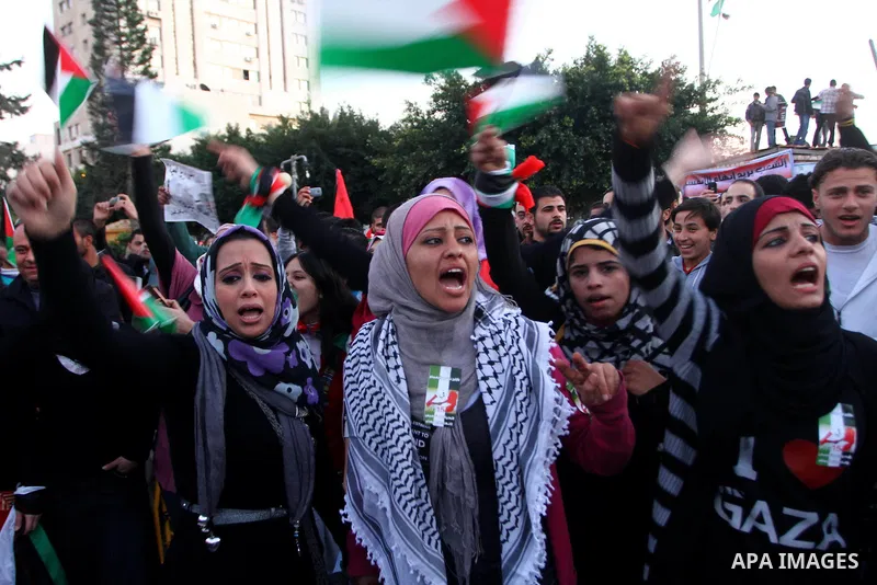 Palestinians participate in a march calling for a reconciliation between the rival Palestinian leading factions Hamas in Gaza and Fatah in the West Bank, in Gaza City, Monday, March 14, 2011. Photo by Ashraf Amra