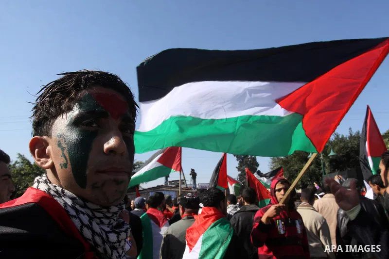 Palestinians youths take apart during a rally calling for a reconciliation between the rival Palestinian leading factions Hamas in Gaza and Fatah in the West Bank, in Gaza City Hundreds of youths demonstrated in the stre...