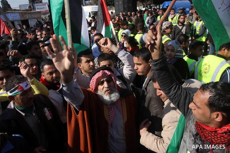 Palestinians youths take apart during a rally calling for a reconciliation between the rival Palestinian leading factions Hamas in Gaza and Fatah in the West Bank, in Gaza City Hundreds of youths demonstrated in the stre...