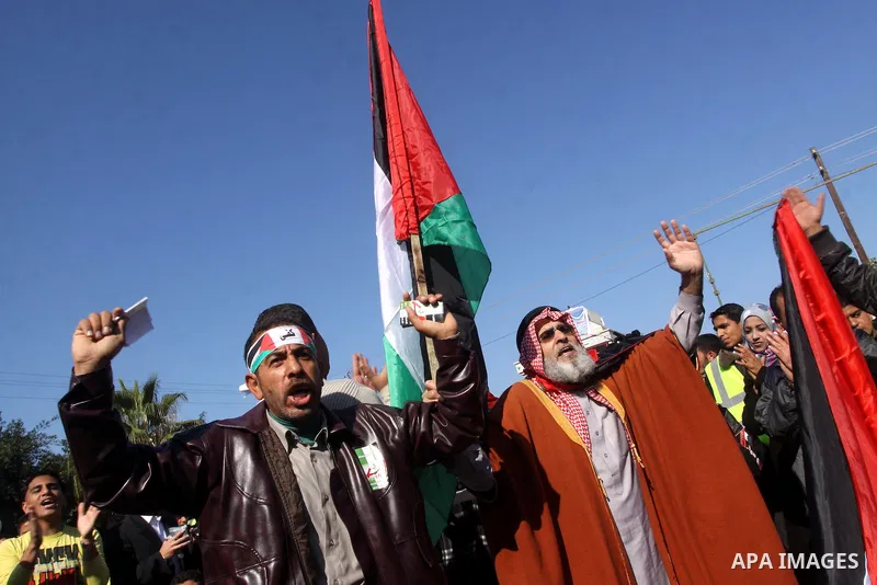 Palestinians youths take apart during a rally calling for a reconciliation between the rival Palestinian leading factions Hamas in Gaza and Fatah in the West Bank, in Gaza City Hundreds of youths demonstrated in the stre...