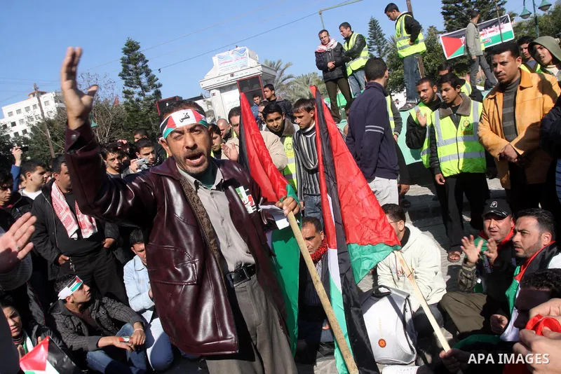 Palestinians youths take apart during a rally calling for a reconciliation between the rival Palestinian leading factions Hamas in Gaza and Fatah in the West Bank, in Gaza City Hundreds of youths demonstrated in the stre...