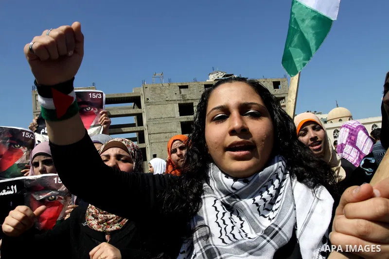 Palestinian demonstrators take part in a protest calling for Palestinian political unity between Gaza's Hamas rulers and the Fatah-dominated Palestinian Authority which rules from Ramallah, on March 15, 2011in Gaza City,...
