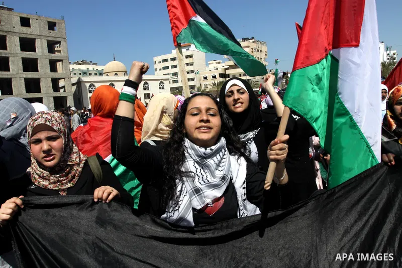Palestinian demonstrators take part in a protest calling for Palestinian political unity between Gaza's Hamas rulers and the Fatah-dominated Palestinian Authority which rules from Ramallah, on March 15, 2011in Gaza City,...
