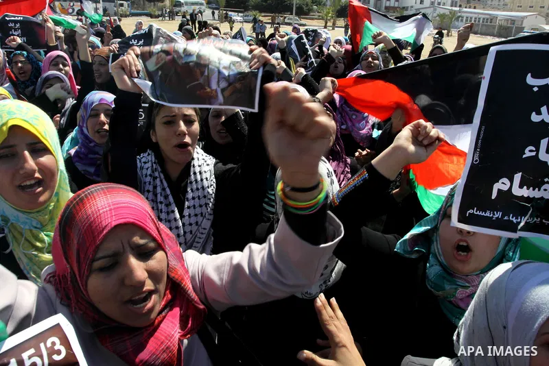 Palestinian demonstrators take part in a protest calling for Palestinian political unity between Gaza's Hamas rulers and the Fatah-dominated Palestinian Authority which rules from Ramallah, on March 15, 2011in Gaza City,...