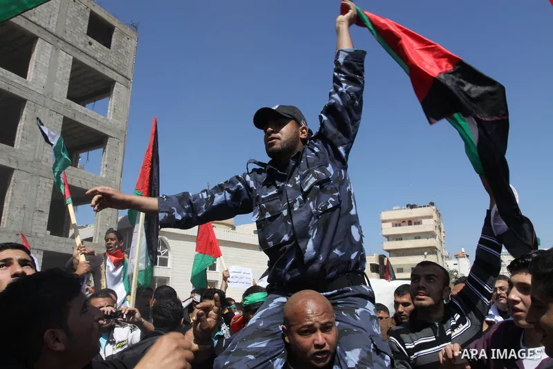 Palestinian Hamas security forces participate with demonstrators in a protest calling for Palestinian political unity between Gaza's Hamas rulers and the Fatah-dominated Palestinian Authority which rules from Ramallah, o...