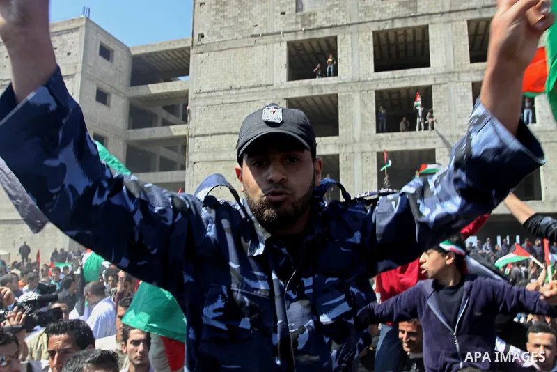 Palestinian Hamas security forces participate with demonstrators in a protest calling for Palestinian political unity between Gaza's Hamas rulers and the Fatah-dominated Palestinian Authority which rules from Ramallah, o...