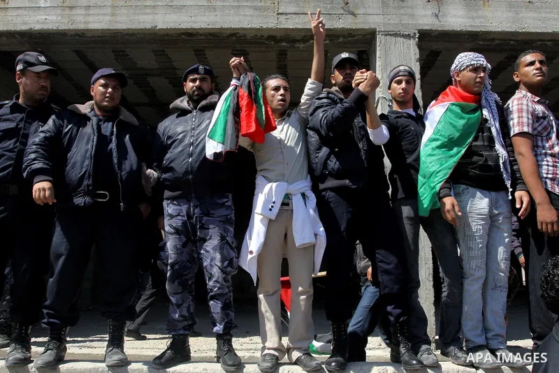 Palestinian Hamas security forces participate with demonstrators in a protest calling for Palestinian political unity between Gaza's Hamas rulers and the Fatah-dominated Palestinian Authority which rules from Ramallah, o...