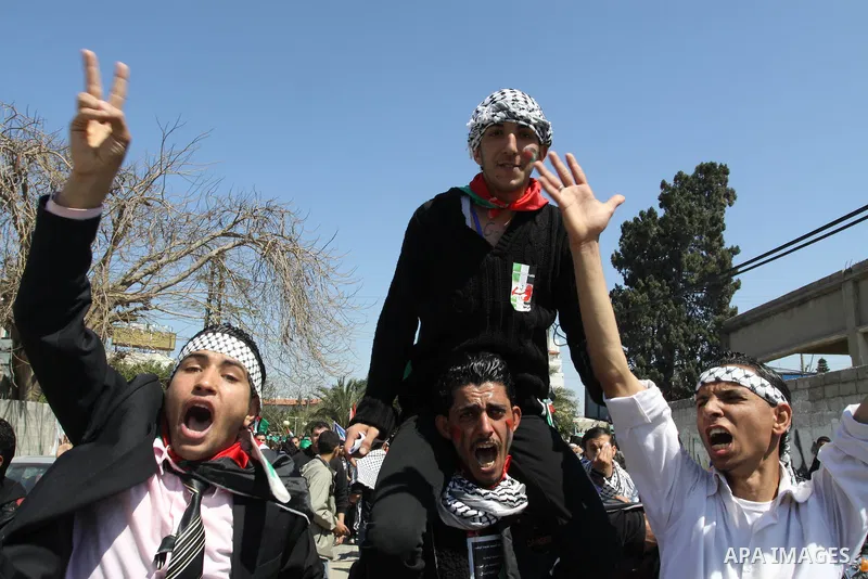 Palestinian demonstrators take part in a protest calling for Palestinian political unity between Gaza's Hamas rulers and the Fatah-dominated Palestinian Authority which rules from Ramallah, on March 15, 2011in Gaza City,...