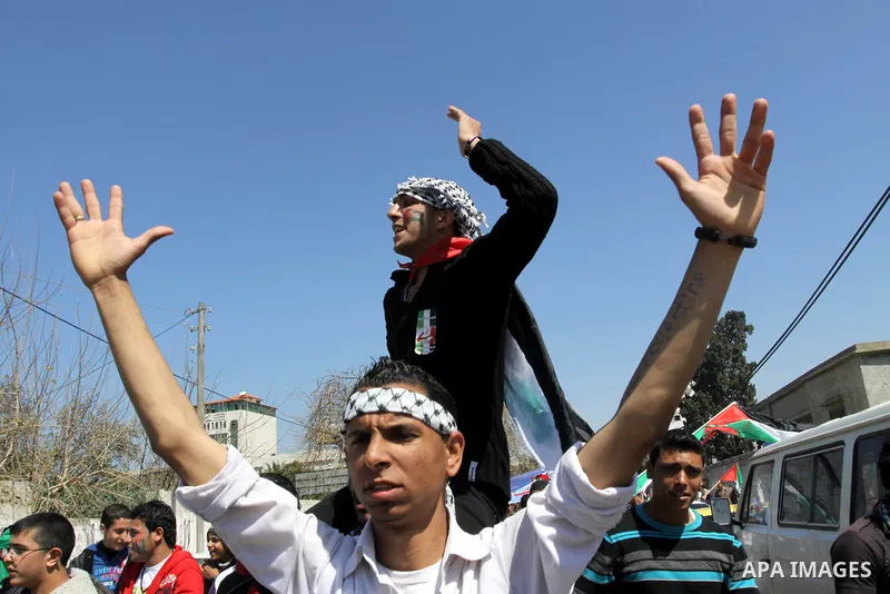 Palestinian demonstrators take part in a protest calling for Palestinian political unity between Gaza's Hamas rulers and the Fatah-dominated Palestinian Authority which rules from Ramallah, on March 15, 2011in Gaza City,...