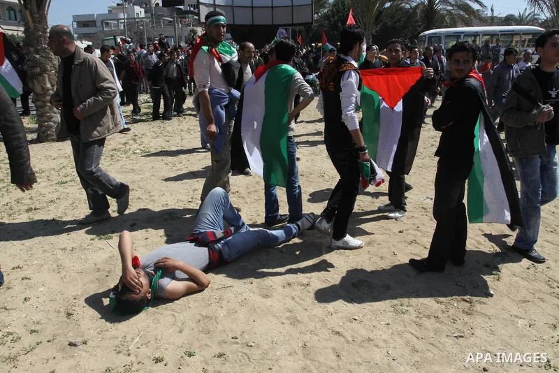 Palestinian demonstrators take part in a protest calling for Palestinian political unity between Gaza's Hamas rulers and the Fatah-dominated Palestinian Authority which rules from Ramallah, on March 15, 2011in Gaza City,...