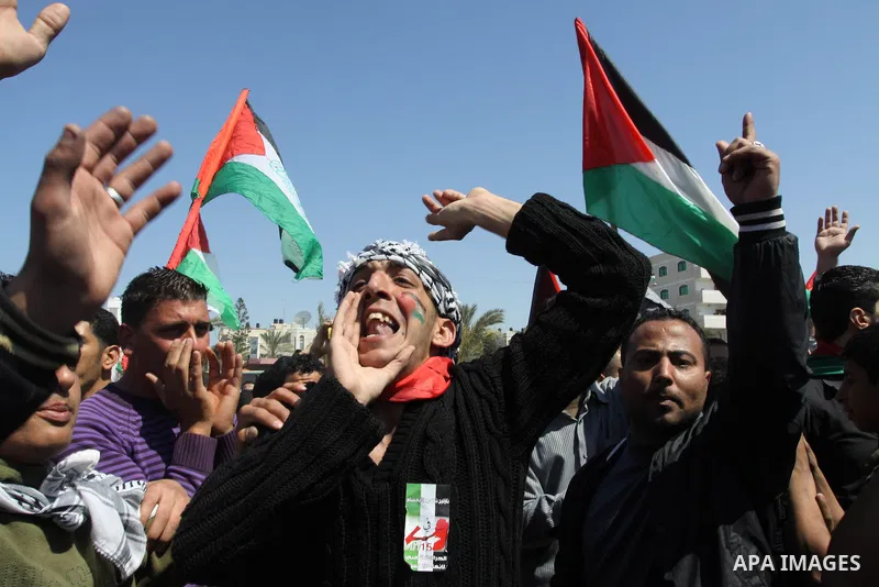 Palestinian demonstrators take part in a protest calling for Palestinian political unity between Gaza's Hamas rulers and the Fatah-dominated Palestinian Authority which rules from Ramallah, on March 15, 2011in Gaza City,...