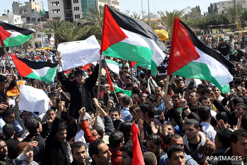 Palestinian demonstrators take part in a protest calling for Palestinian political unity between Gaza's Hamas rulers and the Fatah-dominated Palestinian Authority which rules from Ramallah, on March 15, 2011in Gaza City,...