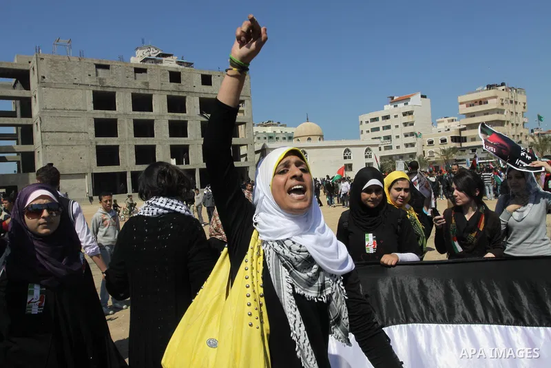 Palestinian demonstrators take part in a protest calling for Palestinian political unity between Gaza's Hamas rulers and the Fatah-dominated Palestinian Authority which rules from Ramallah, on March 15, 2011in Gaza City,...