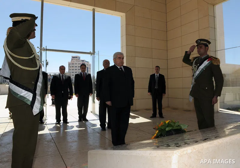 Cypriot President Dimitris Christofias lays a wreath at the tomb of the late Palestinian leader Yasser Arafat in the West Bank city of Ramallah March 15, 2011. Christofias is on an official visit to Israel and the Palest...