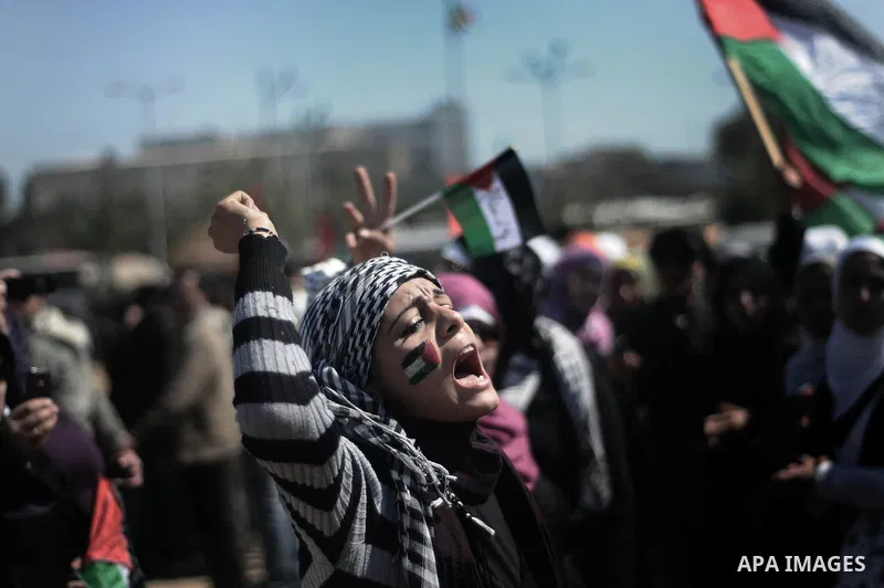 Palestinian demonstrators take part in a protest calling for Palestinian political unity between Gaza's Hamas rulers and the Fatah-dominated Palestinian Authority which rules from Ramallah, on March 15, 2011in Gaza City,...