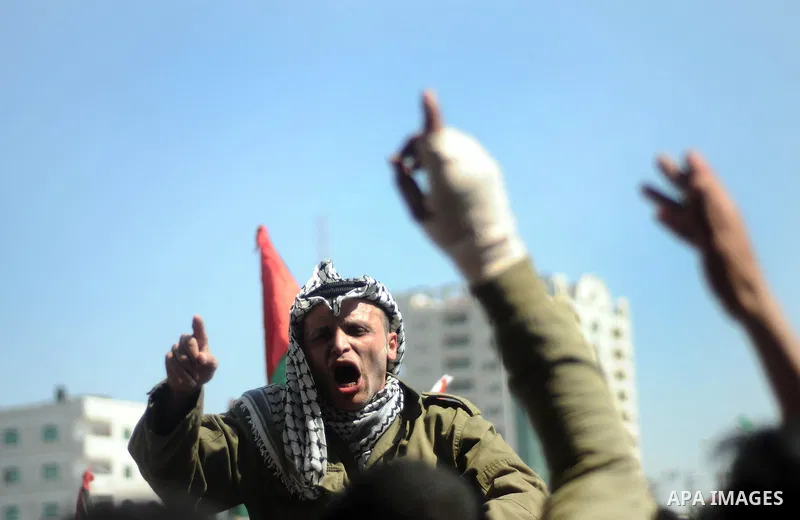 Palestinian demonstrators take part in a protest calling for Palestinian political unity between Gaza's Hamas rulers and the Fatah-dominated Palestinian Authority which rules from Ramallah, on March 15, 2011in Gaza City,...