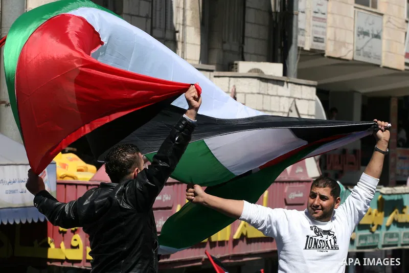 Palestinian demonstrators take part in a protest calling for Palestinian political unity between Gaza's Hamas rulers and the Fatah-dominated Palestinian Authority which rules from Ramallah, on March 15, 2011 in Ramallah,...