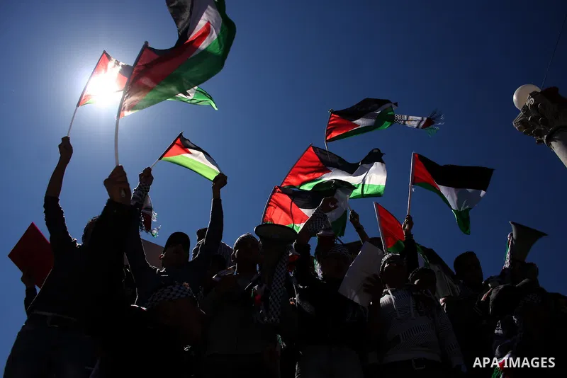 Palestinian demonstrators take part in a protest calling for Palestinian political unity between Gaza's Hamas rulers and the Fatah-dominated Palestinian Authority which rules from Ramallah, on March 15, 2011 in Ramallah,...