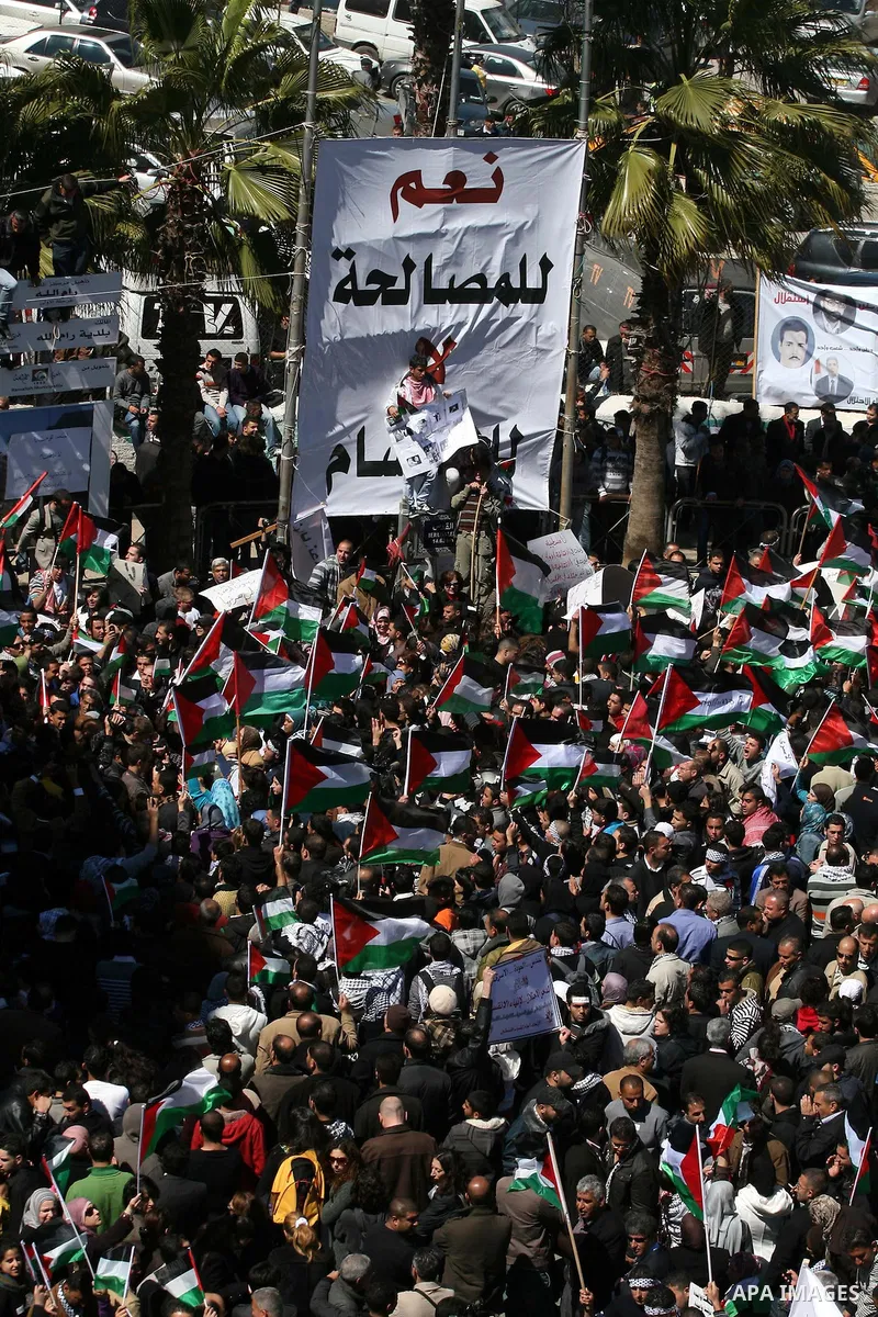 Palestinian demonstrators take part in a protest calling for Palestinian political unity between Gaza's Hamas rulers and the Fatah-dominated Palestinian Authority which rules from Ramallah, on March 15, 2011 in Ramallah,...