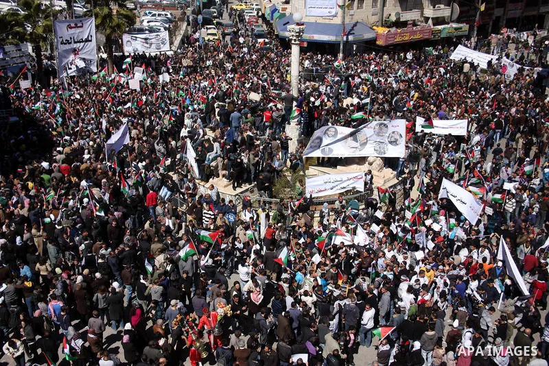 Palestinian demonstrators take part in a protest calling for Palestinian political unity between Gaza's Hamas rulers and the Fatah-dominated Palestinian Authority which rules from Ramallah, on March 15, 2011 in Ramallah,...